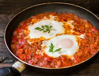 camp cooking - baked eggs in frypan